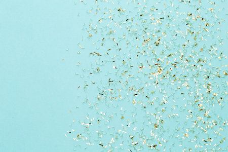 Christmas stars and shining glitter, confetti on pastelの写真素材