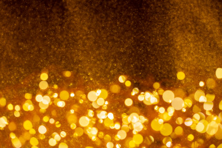 Christmas and Happy new year on blurred gold bokeh bannerの写真素材