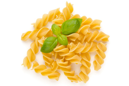 Raw uncooked pasta penne on the white background.の写真素材