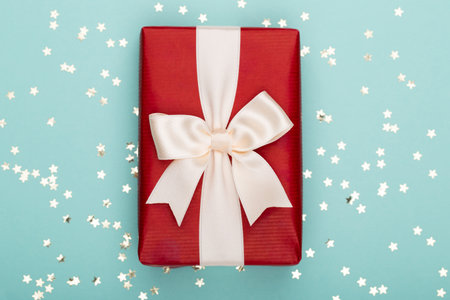 Glittering christmas background. Star dust and golden glitter. Holidays background for web and print.の写真素材