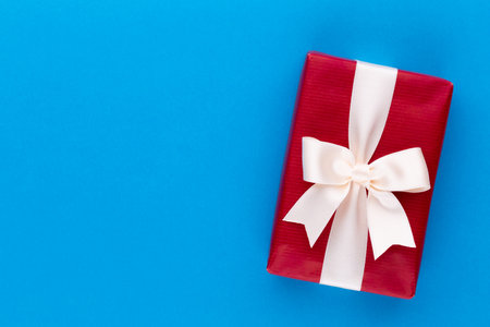 Christmas gift boxes with ribbons on color tabletop.の写真素材