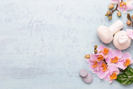 Spa aromatherapy background, flat lay of various beauty care products decorated with simple orchid flowers.の写真素材