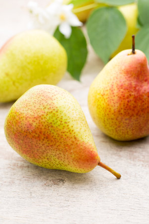 Fresh bio ripe organic pears on rustic wooden table.の写真素材
