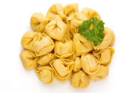 Raw homemade pasta,tortellini with herbs.の写真素材