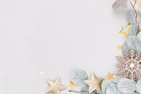 Festive pastel background. Christmas stars and shining glitter, confetti on pastel background. Christmas background, Flat lay.の写真素材