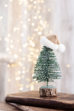 Christmas tree on wooden, bokeh background. Christmas holiday celebration concept. Greeting card.の写真素材