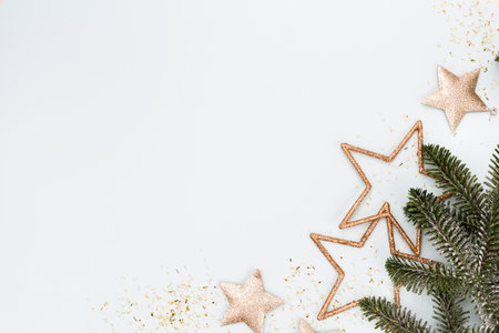 Festive pastel background. Christmas stars and shining glitter, confetti on pastel background....