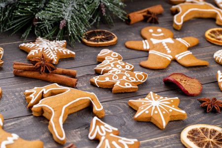 Tasty gingerbread cookies and Christmas decor on wooden background.の写真素材