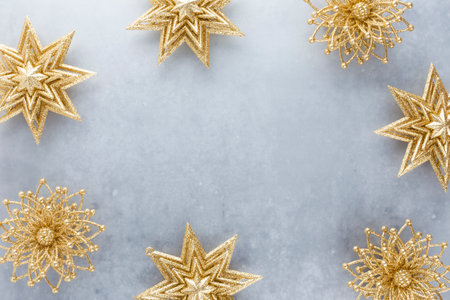 Festive pastel background. Christmas stars and shining glitter, confetti on pastel background. Christmas background, Flat lay.の写真素材