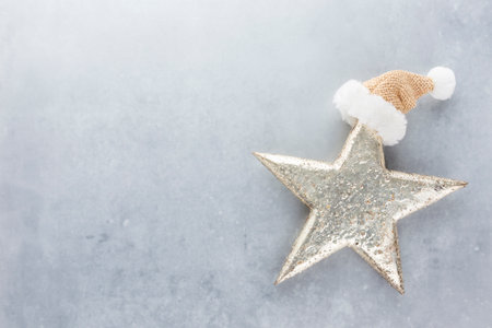 Festive pastel background. Christmas stars and shining glitter, confetti on pastel background. Christmas background, Flat lay.の写真素材