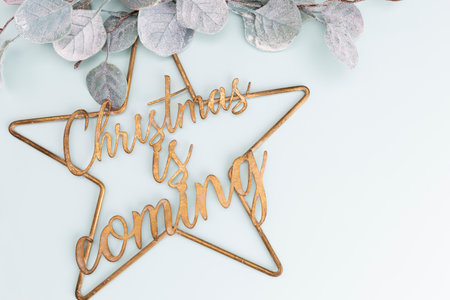 Festive pastel background. Christmas stars and shining glitter, confetti on pastel background. Christmas background, Flat lay.の写真素材