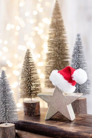 Christmas tree on wooden, bokeh background. Christmas holiday celebration concept. Greeting card.の写真素材