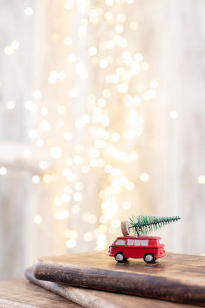 Christmas tree on wooden, bokeh background. Christmas holiday celebration concept. Greeting card.の写真素材