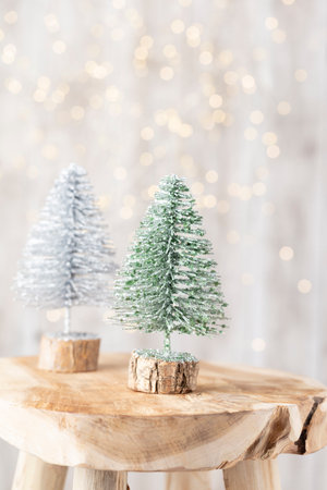 Christmas tree on wooden, bokeh background. Christmas holiday celebration concept. Greeting card.の写真素材