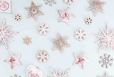 Festive pastel background. Christmas stars and shining glitter, confetti on pastel background. Christmas background, Flat lay.の写真素材