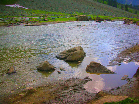 a riverfront in the mountainsの写真素材