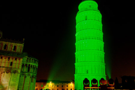 Pisa, Italy - march 16, 2012 - The leaning tower of Pisa is coloured with green lights in occasion of the saint patrick's day in sign of friendship betweet italy and the republic of ireland.のeditorial素材