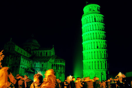 Pisa, Italy - march 16, 2012 - The leaning tower of Pisa is coloured with green lights in occasion of the saint patrick's day in sign of friendship betweet italy and the republic of ireland.のeditorial素材
