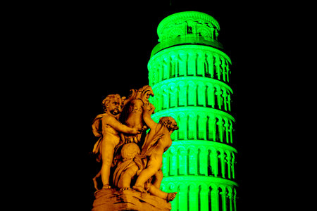 Pisa, Italy - march 16, 2012 - The leaning tower of Pisa is coloured with green lights in occasion of the saint patrick's day in sign of friendship betweet italy and the republic of ireland.のeditorial素材