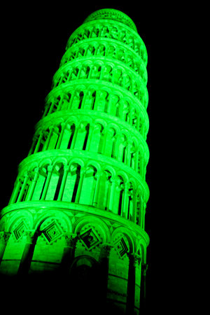 Pisa, Italy - march 16, 2012 - The leaning tower of Pisa is coloured with green lights in occasion of the saint patrick's day in sign of friendship betweet italy and the republic of ireland. のeditorial素材