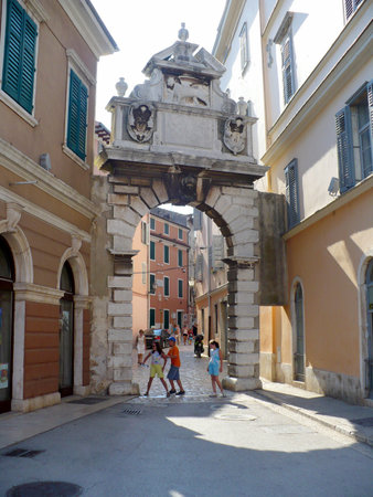 Croatia, peninsula Istria, Rovinj - July 28, 2008: Ancient Roman gate in Old Town in Rovinj  のeditorial素材