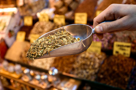 Man selling assorted natural medical dried herbsの写真素材