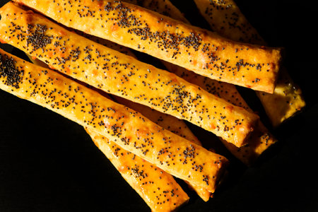 Traditional Italian snack, bread ,grissini on black table, top view,の写真素材