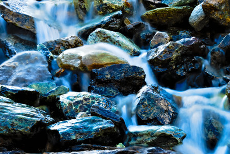 water flowing along the rapids of a riverの写真素材