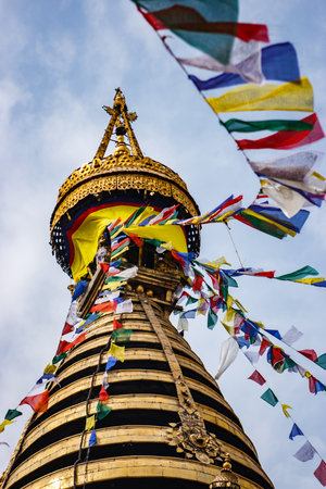 The golden stupa of the Swayambunath Temple with flags, Kathmandu, Nepalの写真素材
