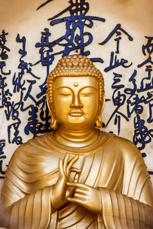 Golden statue of Buddha a the World Peace Pagoda, Pokhara, Nepalのeditorial素材