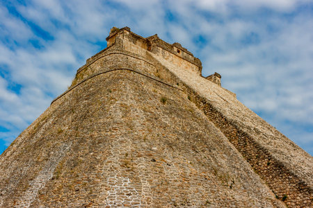 Side view of the piramyd of the wizard at the Uxmal archaeological site, Yucatan, Mexico.の写真素材