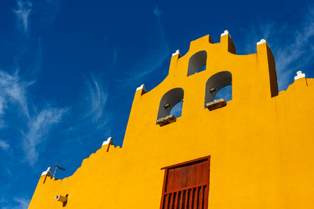 Colored houses and buildings over a blue sky in Campeche, Mexico.の写真素材