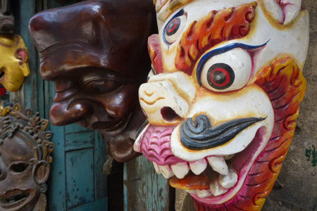 Detail fo a wooden mask for sale at a street market Kathmandu, Nepal