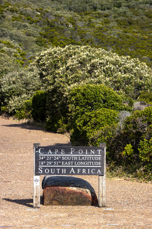 PIcture of a sign indicating Cape Point with longitude e latitude near Cape Town, South africaのeditorial素材