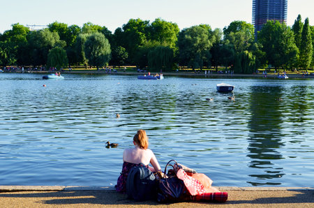 red hair girl looking the lakeの写真素材