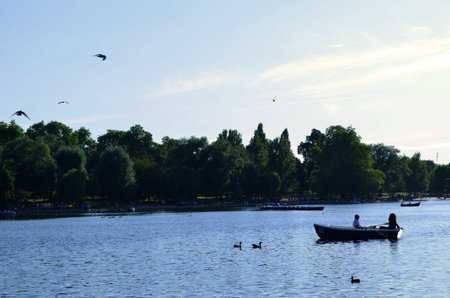 couple in love on boat crossing the lakeの写真素材