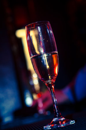Champagne flute in a night club during partyの写真素材