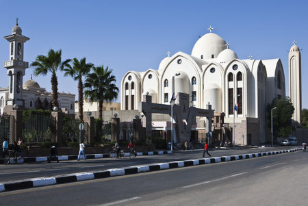 Aswan, Egypt - January 15, 2010: People walking in front of the Coptic cathedralのeditorial素材