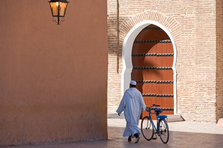 Marrakech, Morocco - March 25, 2006: Local people walking in front of the side door of the great Koutoubia mosqueのeditorial素材