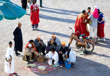 Marrakech, Morocco - March 26, 2006: Local people in the famous Jemaa el Fna square.のeditorial素材