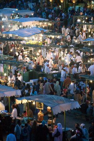 Marrakech, Morocco - March 26, 2006: Night view of the open air restaurants in the famous Jemaa el Fna square.のeditorial素材