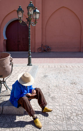 Marrakech, Morocco - March 22, 2006: A local man sitting in the Kasbah quarterのeditorial素材