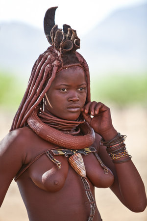 Kaokoland, Namibia - December 9, 2009: A young local woman in a Himba villageのeditorial素材