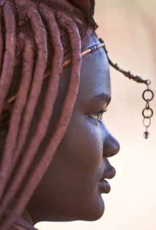 Kaokoland, Namibia - December 9, 2009: A young local woman in a Himba villageのeditorial素材