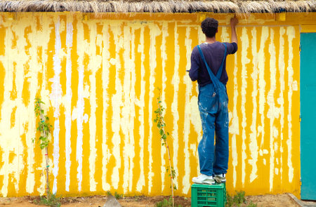 Hammamet, Tunisia - May 2, 2007: A young man doing maintenance in the Yasmine areaのeditorial素材
