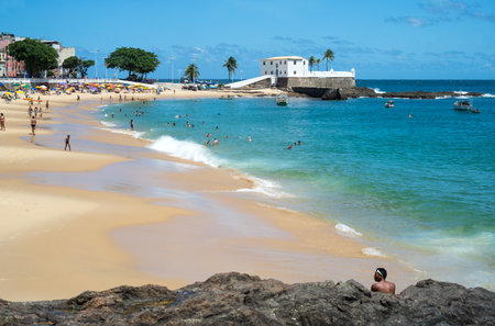 Salvador, Brazil - September 11, 2013:  Barra district, people on the beach near the Santa Maria fortressのeditorial素材