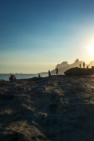 Rio De Janeiro, Brazil  - September 9, 2013: People on the Pedra do Arpoador promontory at sunsetのeditorial素材
