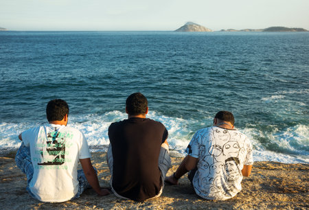 Rio De Janeiro, Brazil  - September 9, 2013: People on the Pedra do Arpoador promontory at sunsetのeditorial素材