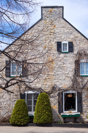 Baie Saint Paul,  Canada - May 6, 2014: Quebec,  the old Otis house  in St Jean Baptiste streetのeditorial素材