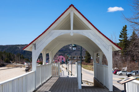 Tedoussac,  Canada - May 8, 2014: Quebec, the  covered bridge that leads to the St Lorenzo river harbourのeditorial素材